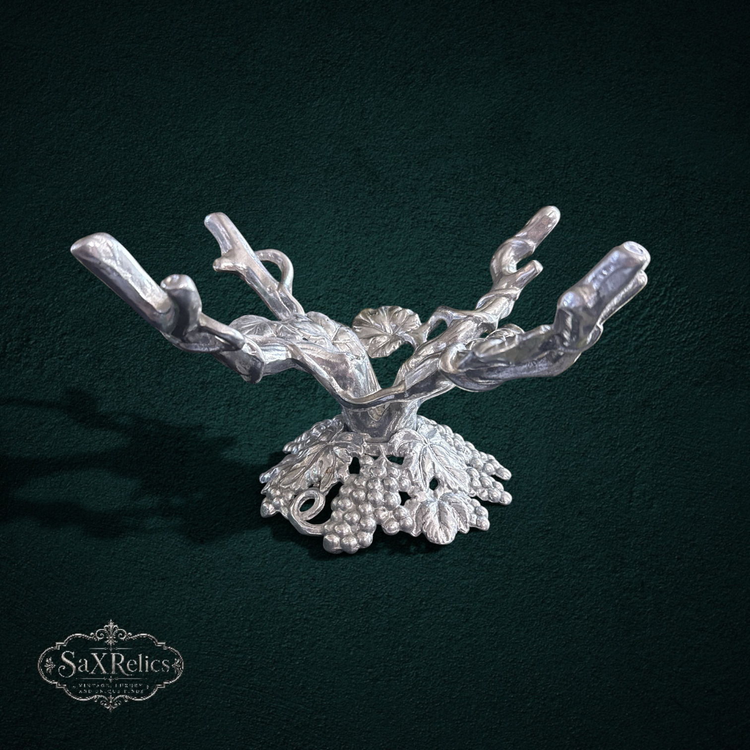 My Store silver-tone metal tabletop display stand with intricate grapevine and leaf motif for fruit or decor.