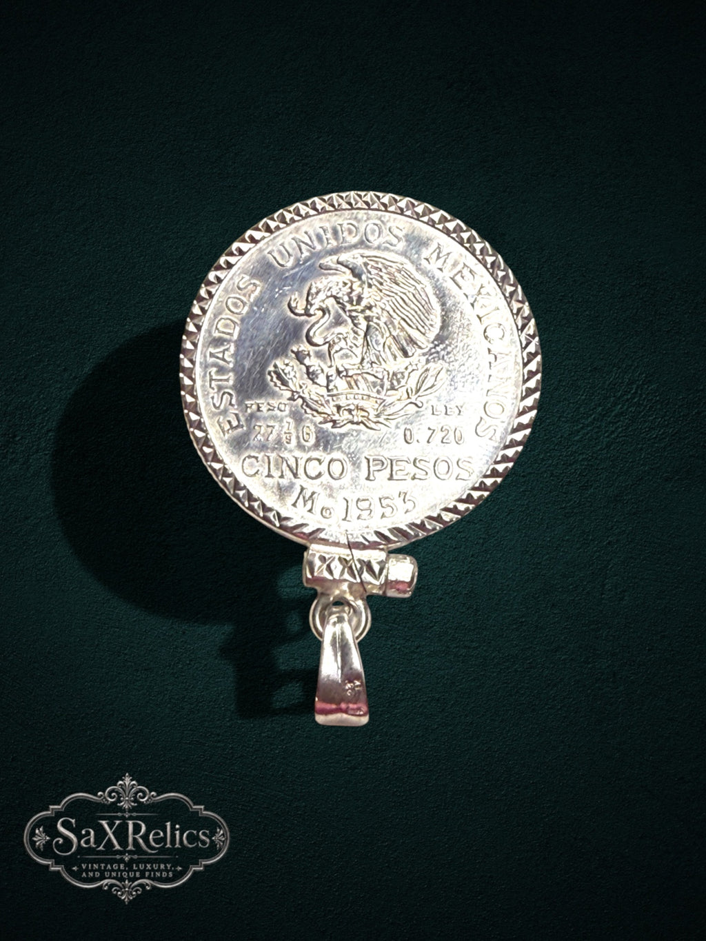 My Store vintage 1953 Mexican Cinco Pesos silver coin pendant with a detailed textured bezel on a dark background.