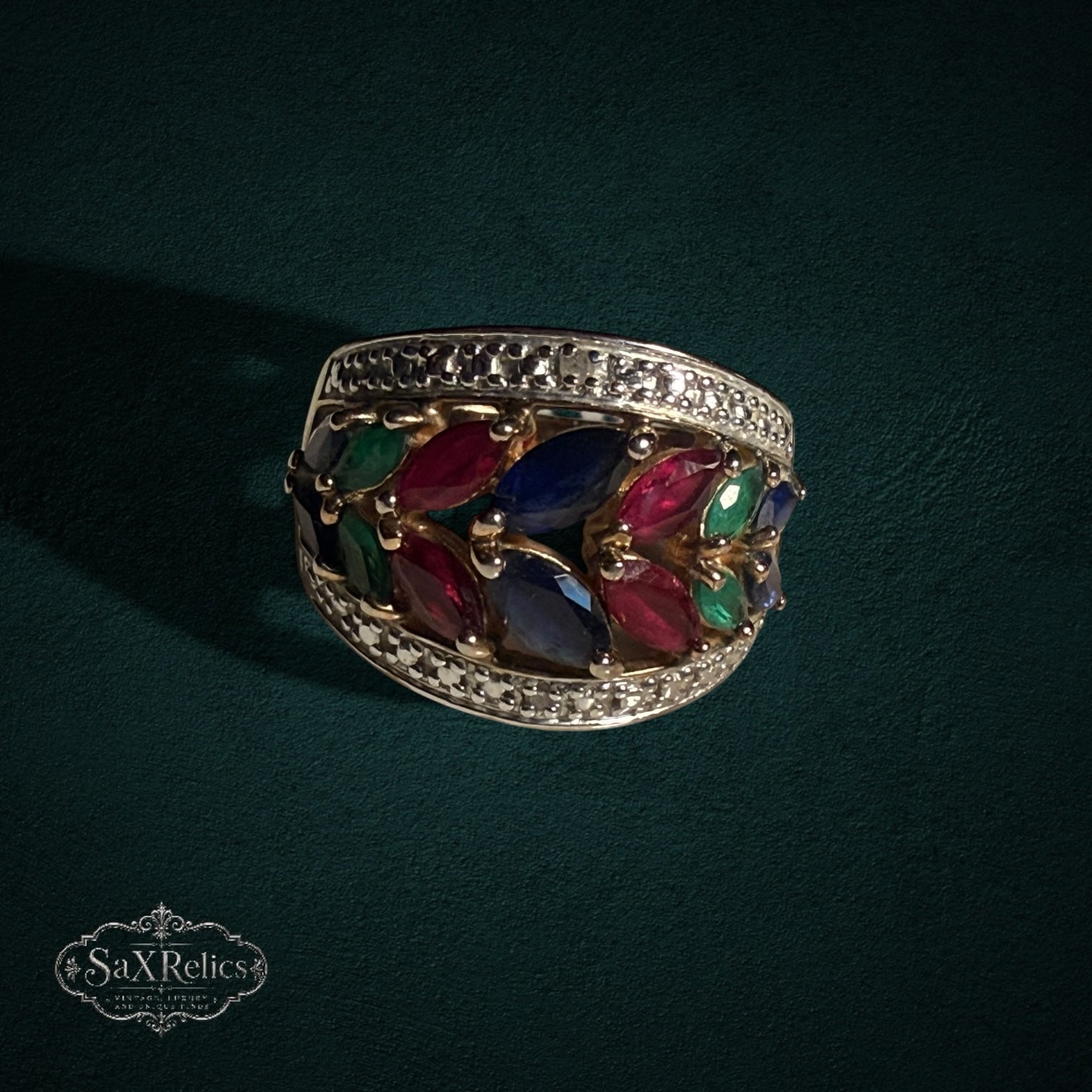 My Store statement ring featuring marquise-cut rubies, sapphires, and emeralds in a gold-tone leaf-inspired setting.