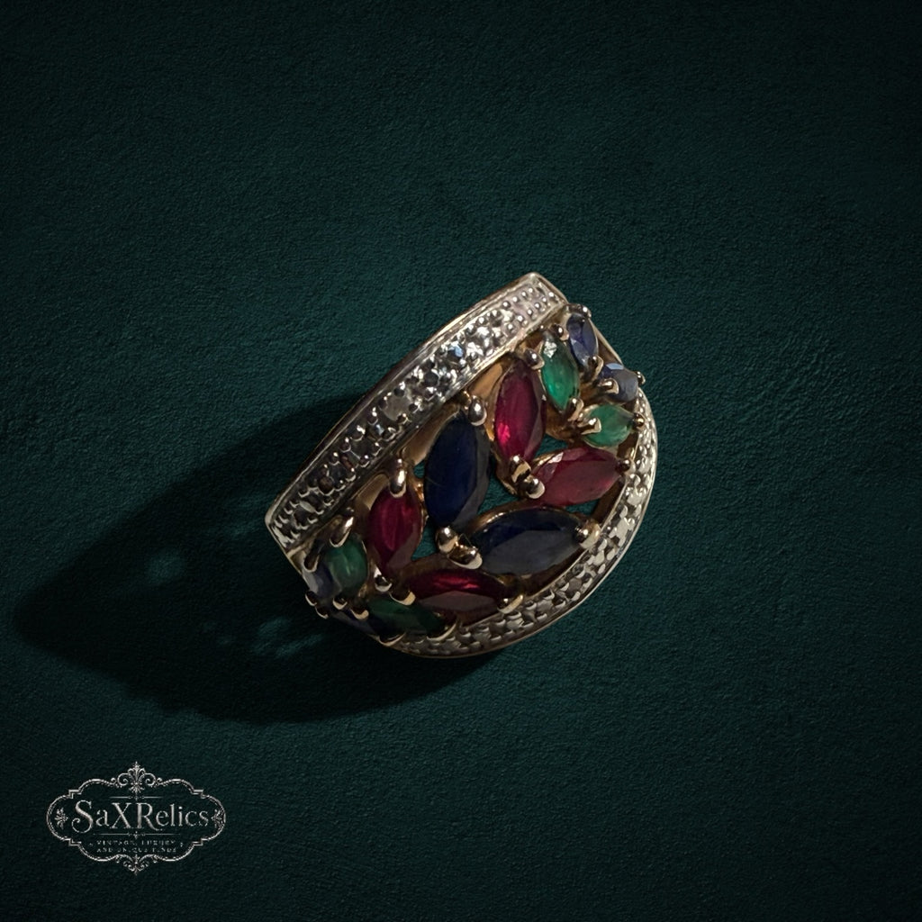 My Store statement ring featuring marquise-cut rubies, sapphires, and emeralds in a gold-tone leaf-inspired setting.