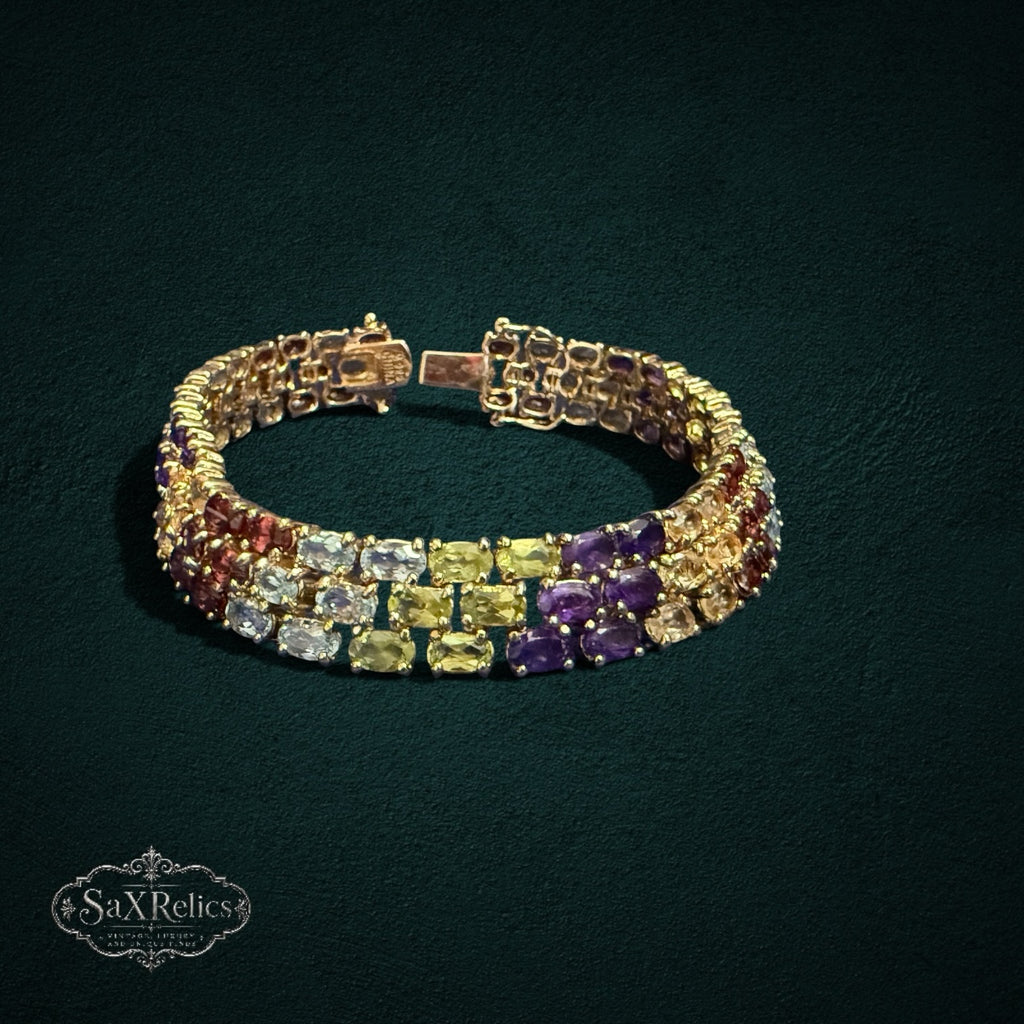 My Store triple-row link bracelet featuring oval-cut multi-colored gemstones set in gold-tone 925 sterling silver.