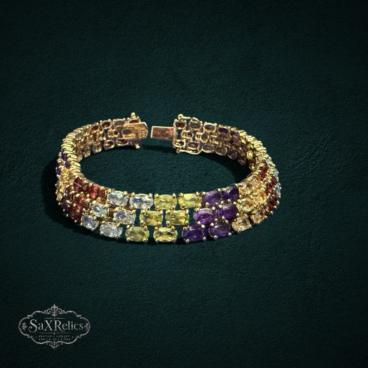 My Store triple-row link bracelet featuring oval-cut multi-colored gemstones set in gold-tone 925 sterling silver.