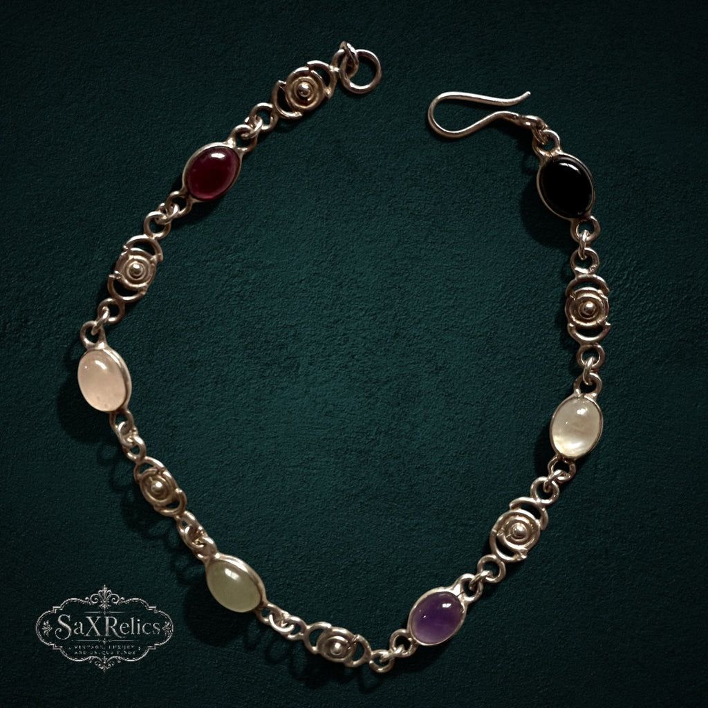 SaX Relics — Espiral vintage sterling silver bracelet set with six oval stones between spiral links.