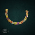 My Store triple-row link bracelet featuring oval-cut multi-colored gemstones set in gold-tone 925 sterling silver.