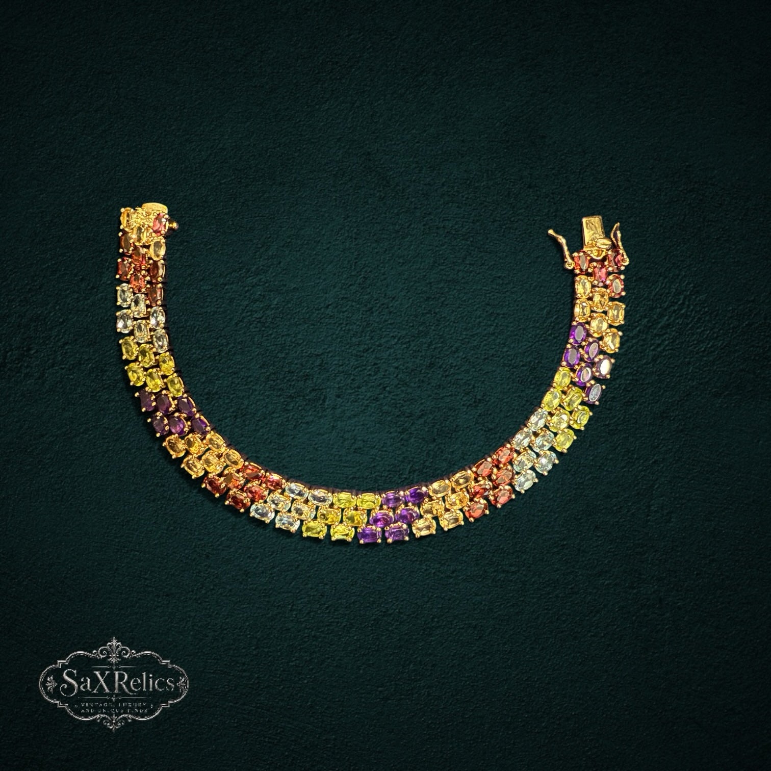 My Store triple-row link bracelet featuring oval-cut multi-colored gemstones set in gold-tone 925 sterling silver.