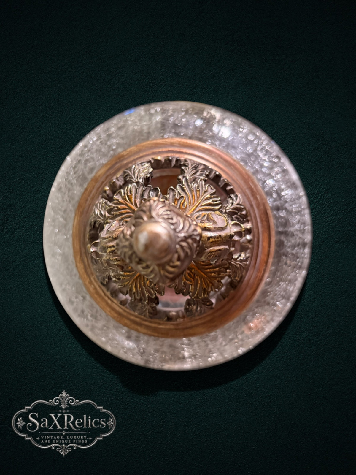 My Store decorative glass pedestal jar lid with ornate antique bronze filigree and leaf detailing, top-down view