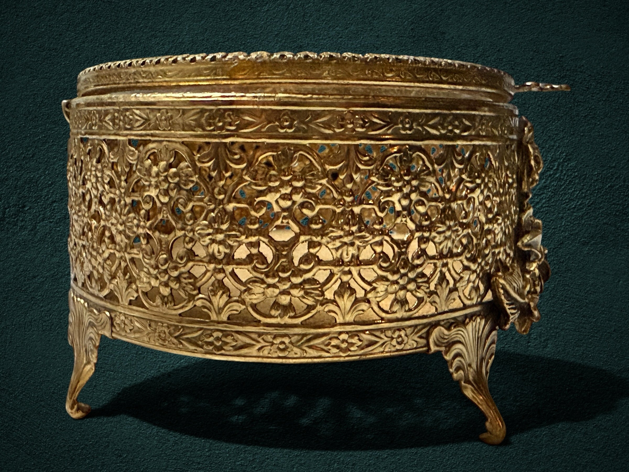 My Store ornate gold-plated metal jewelry box with intricate filigree floral patterns and decorative cabriole feet.