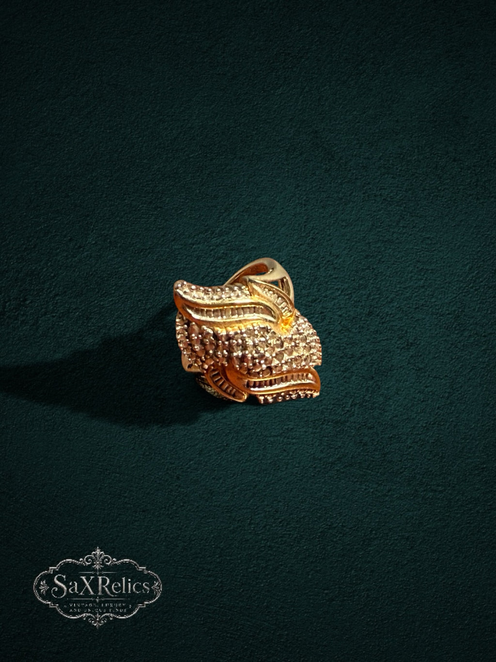 My Store SAXRelics ornate gold statement ring featuring intricate textured layers and brilliant-cut stone accents.