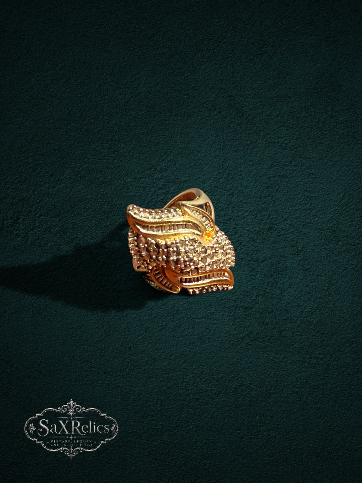 My Store SAXRelics ornate gold statement ring featuring intricate textured layers and brilliant-cut stone accents.