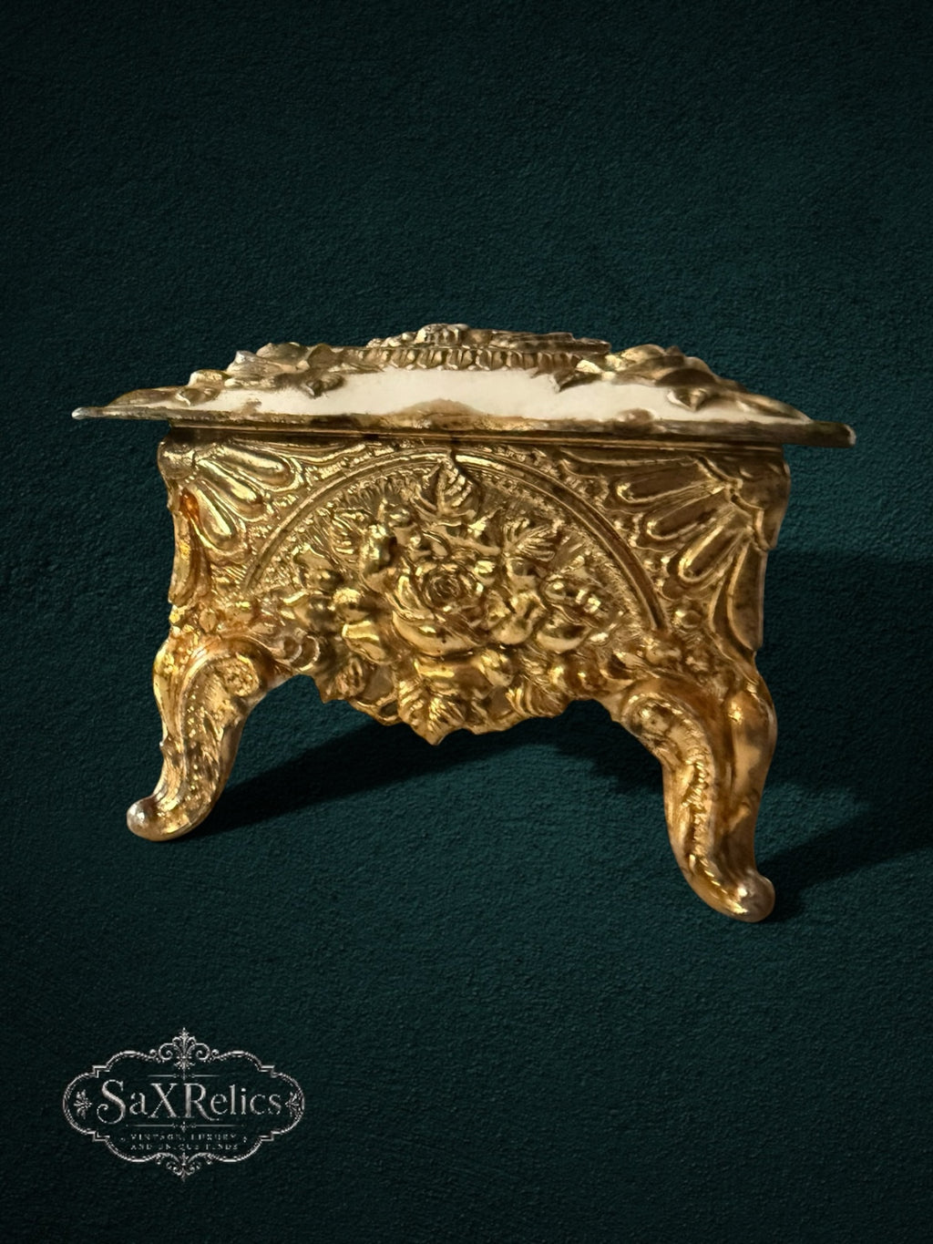 My Store ornate gold-tone metal trinket box with intricate floral relief, sculpted roses, and vintage-inspired feet.