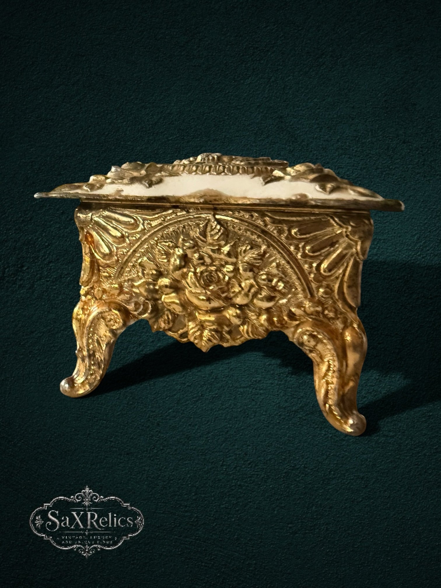 My Store ornate gold-tone metal trinket box with intricate floral relief, sculpted roses, and vintage-inspired feet.