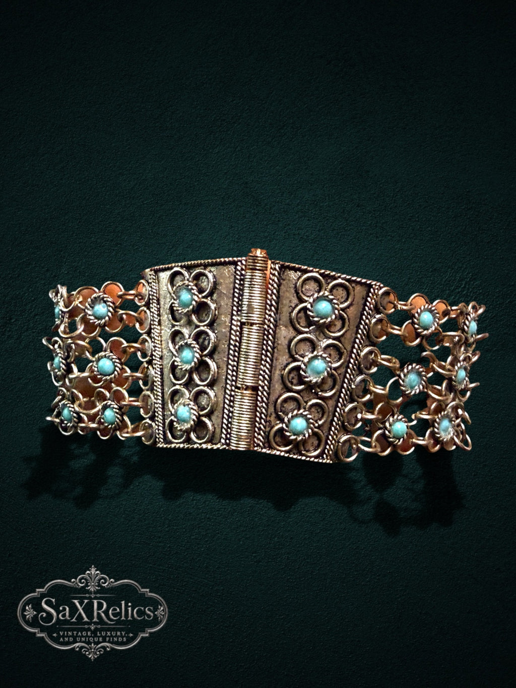 SaX Relics ornate link bracelet featuring antiqued metal, intricate rope-style details, and robin-egg blue stones.