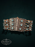 SaX Relics ornate link bracelet featuring antiqued metal, intricate rope-style details, and robin-egg blue stones.