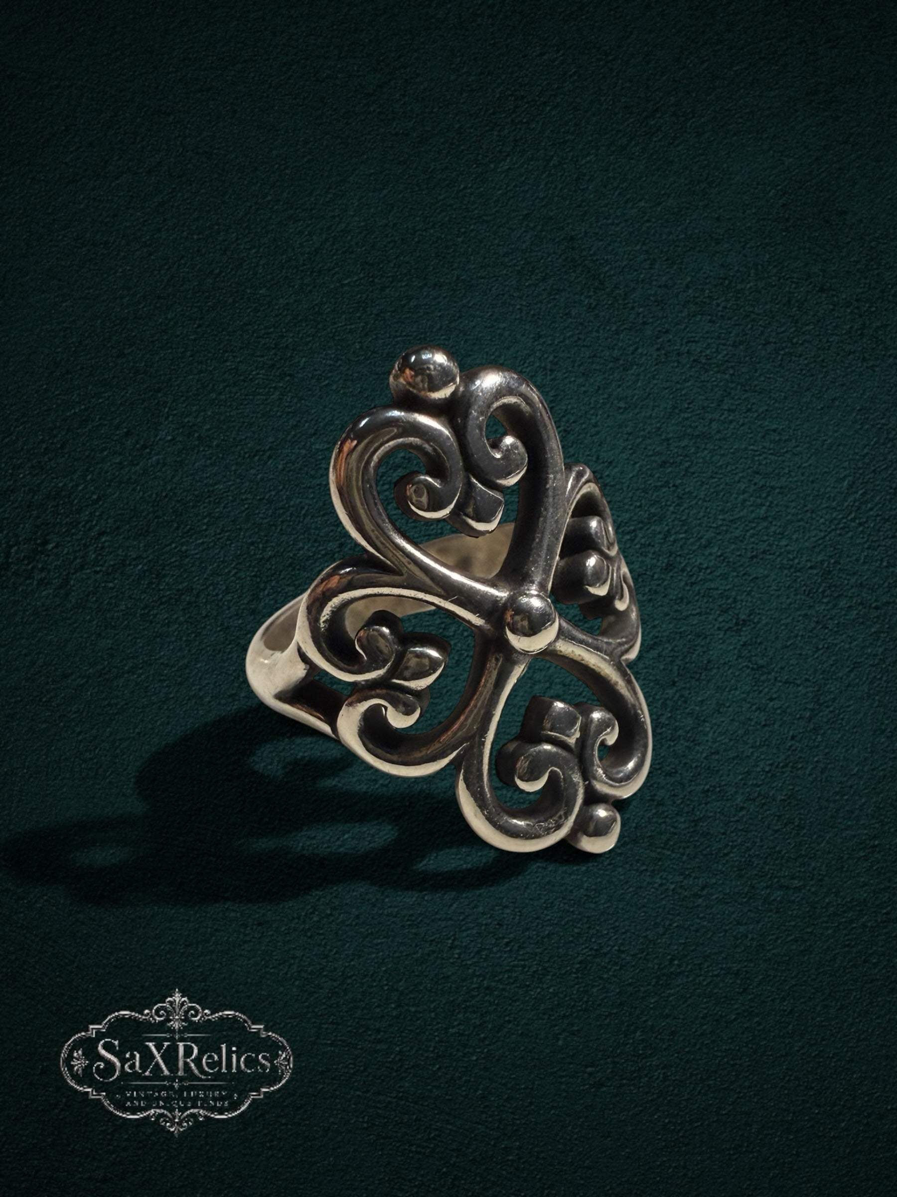 My Store SAXRelics sterling silver ring featuring an ornate quatrefoil filigree design with a polished finish.