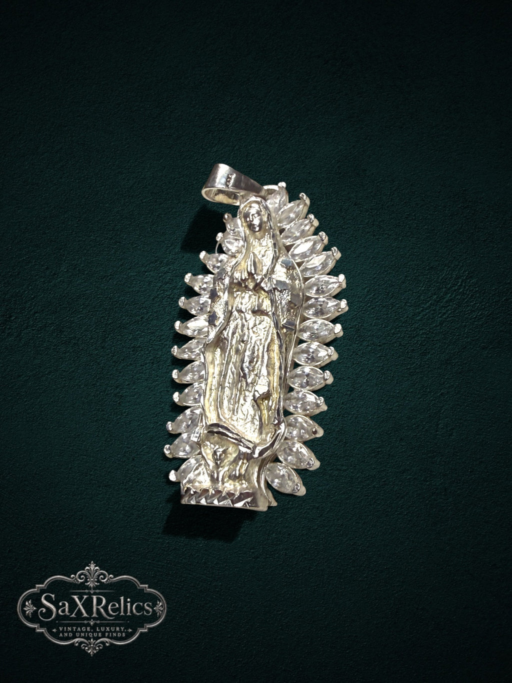 My Store sterling silver Our Lady of Guadalupe pendant with marquise-cut clear stones and detailed relief design.