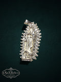 My Store sterling silver Our Lady of Guadalupe pendant with marquise-cut clear stones and detailed relief design.