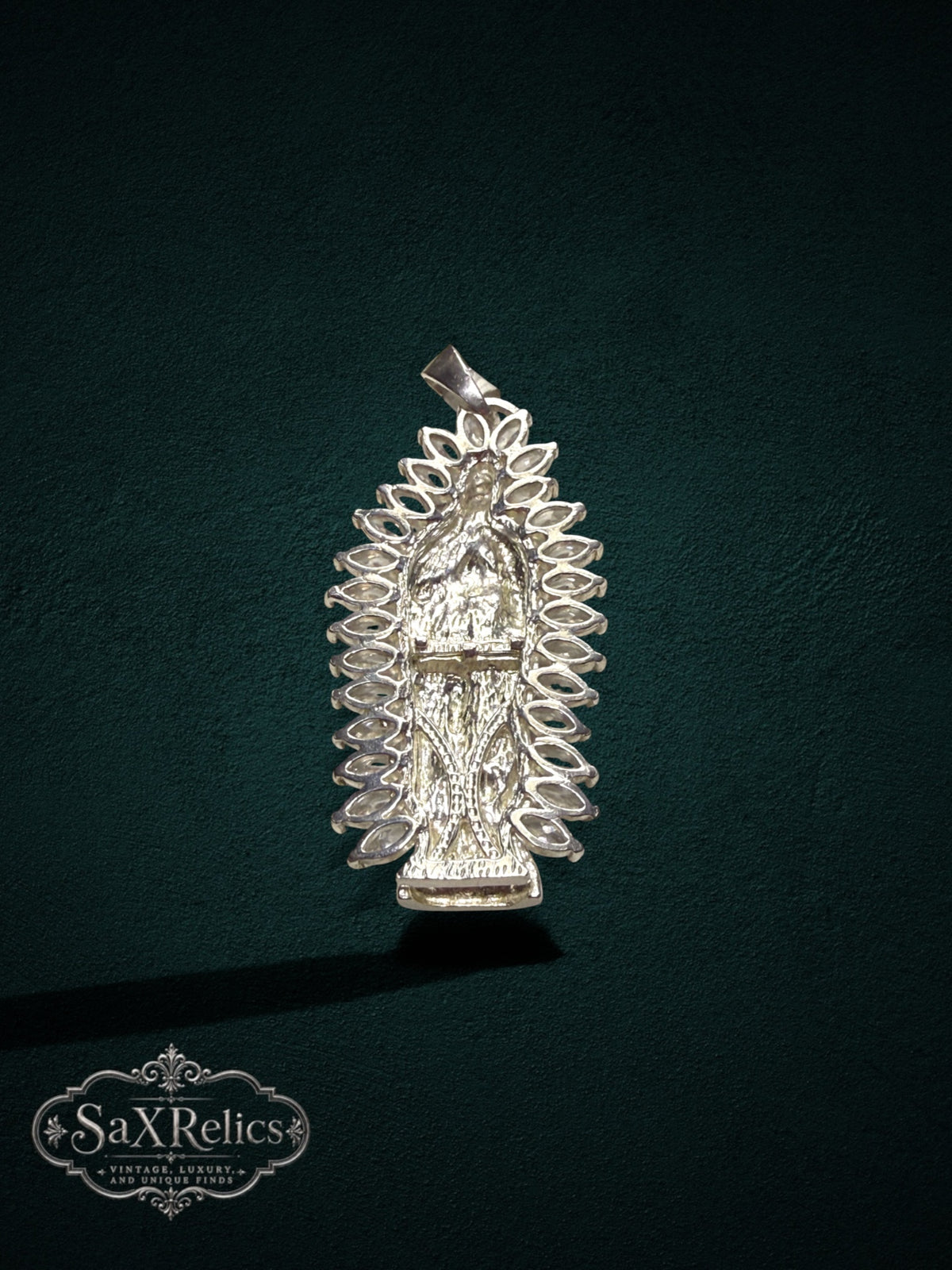 My Store sterling silver Our Lady of Guadalupe pendant with marquise-cut clear stones and detailed relief design.