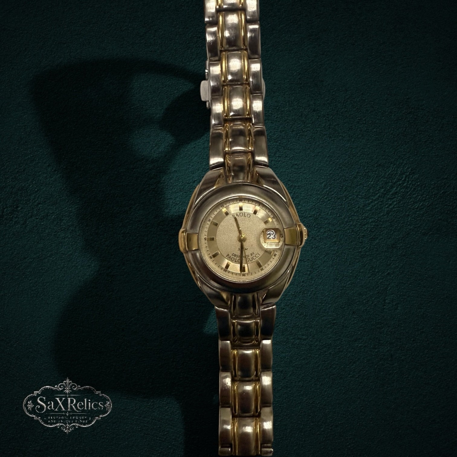 My Store PAOLO Designed By PAOLO GUCCI two-tone stainless steel wristwatch with a textured gold dial and date window.