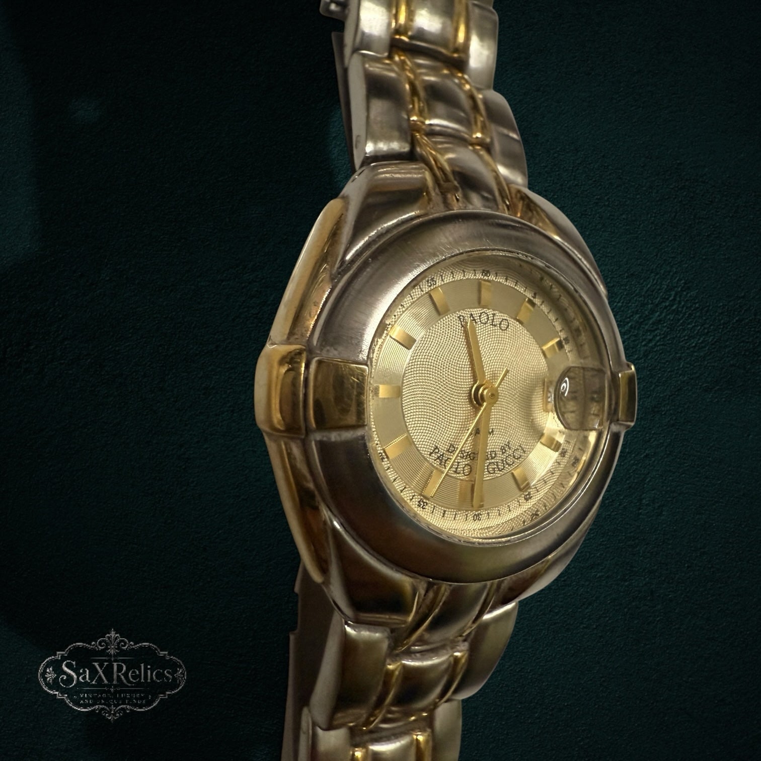 My Store PAOLO Designed By PAOLO GUCCI two-tone stainless steel and gold wristwatch with a textured gold dial.