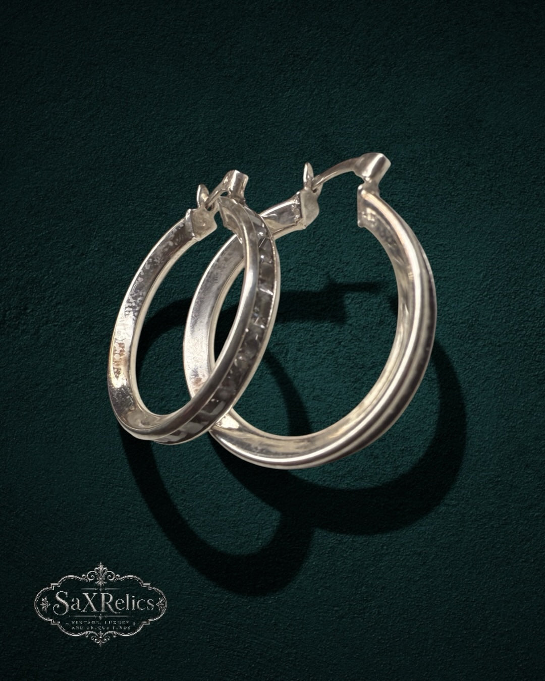 My Store SaxRelics polished sterling silver hoop earrings with a classic medium-gauge silhouette and hinged closure.