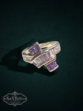 My Store statement ring featuring baguette-cut purple and clear stones on a polished silver-tone metal band.