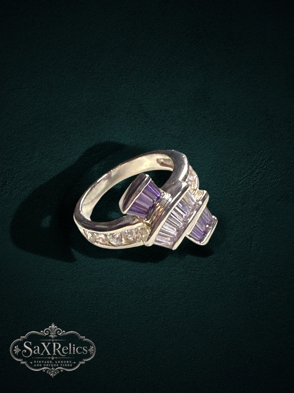 My Store statement ring featuring baguette-cut purple and clear stones on a polished silver-tone band