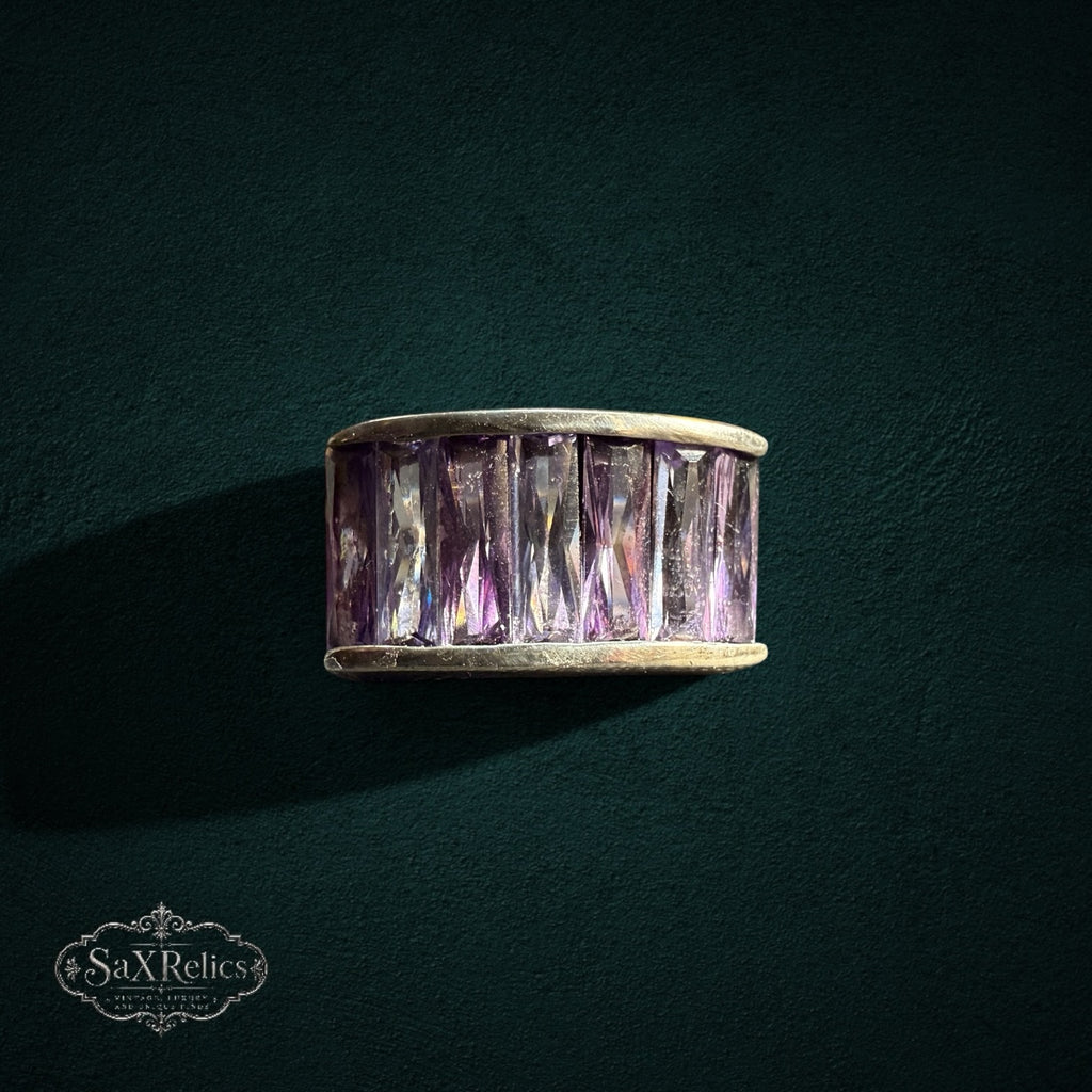 My Store SAXRelics wide band ring featuring baguette-cut purple stones in a polished metal setting.