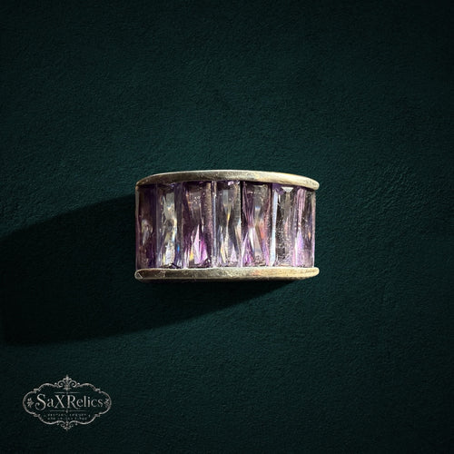 My Store SAXRelics wide band ring featuring baguette-cut purple stones in a polished metal setting.