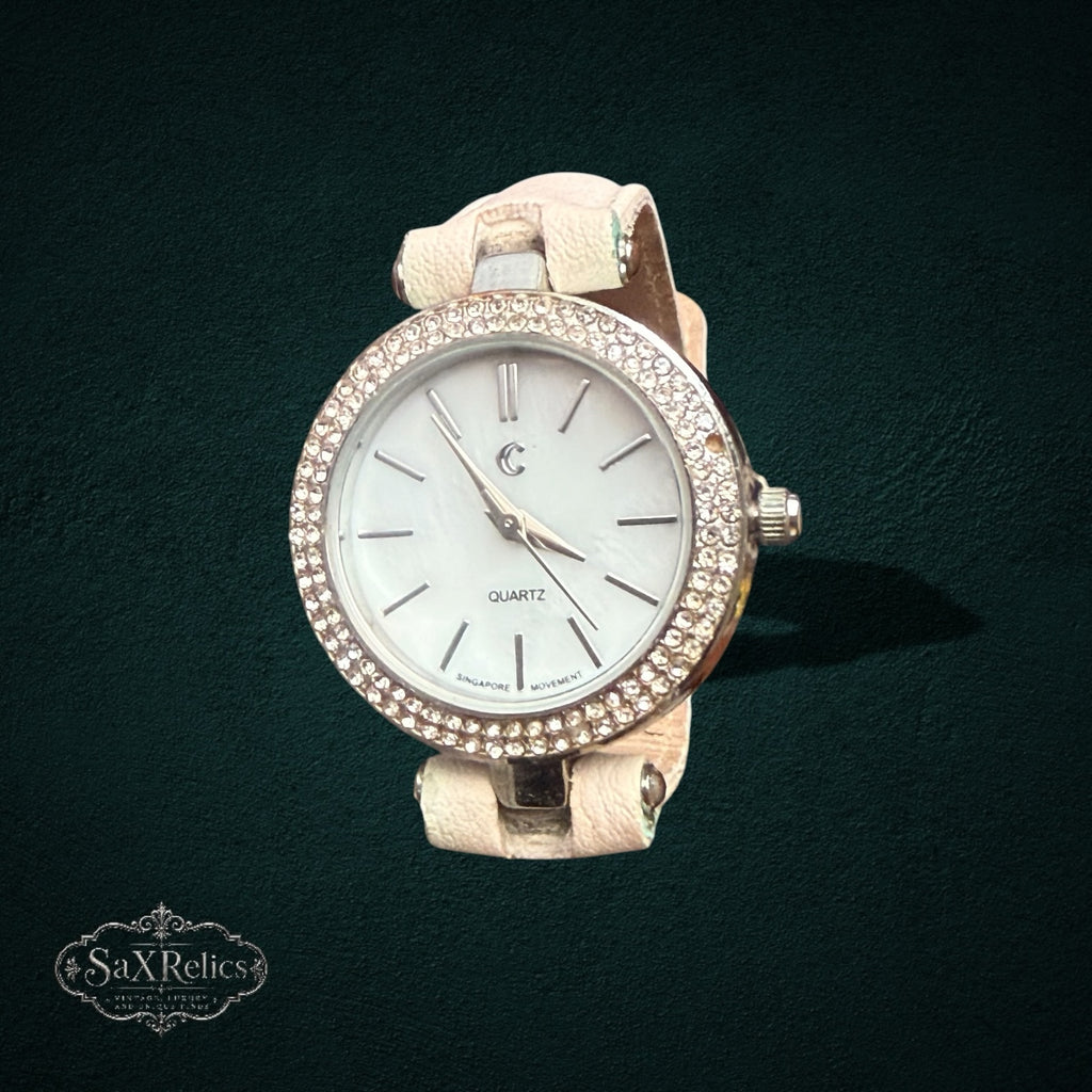 My Store elegant analog quartz wristwatch with a light beige leather strap and a crystal-encrusted bezel.