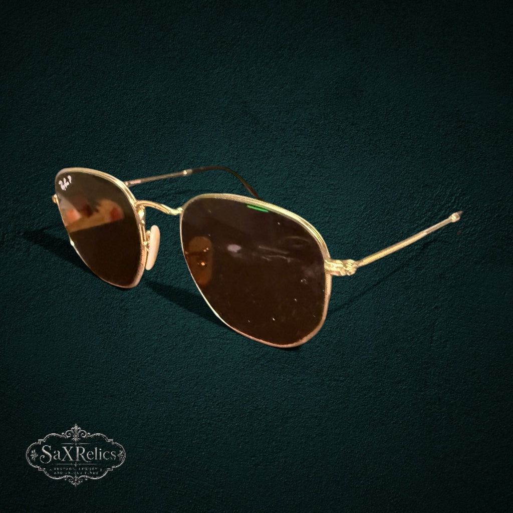 My Store Ray-Ban gold-tone metal geometric sunglasses with polarized lenses for glare reduction and comfortable wear.