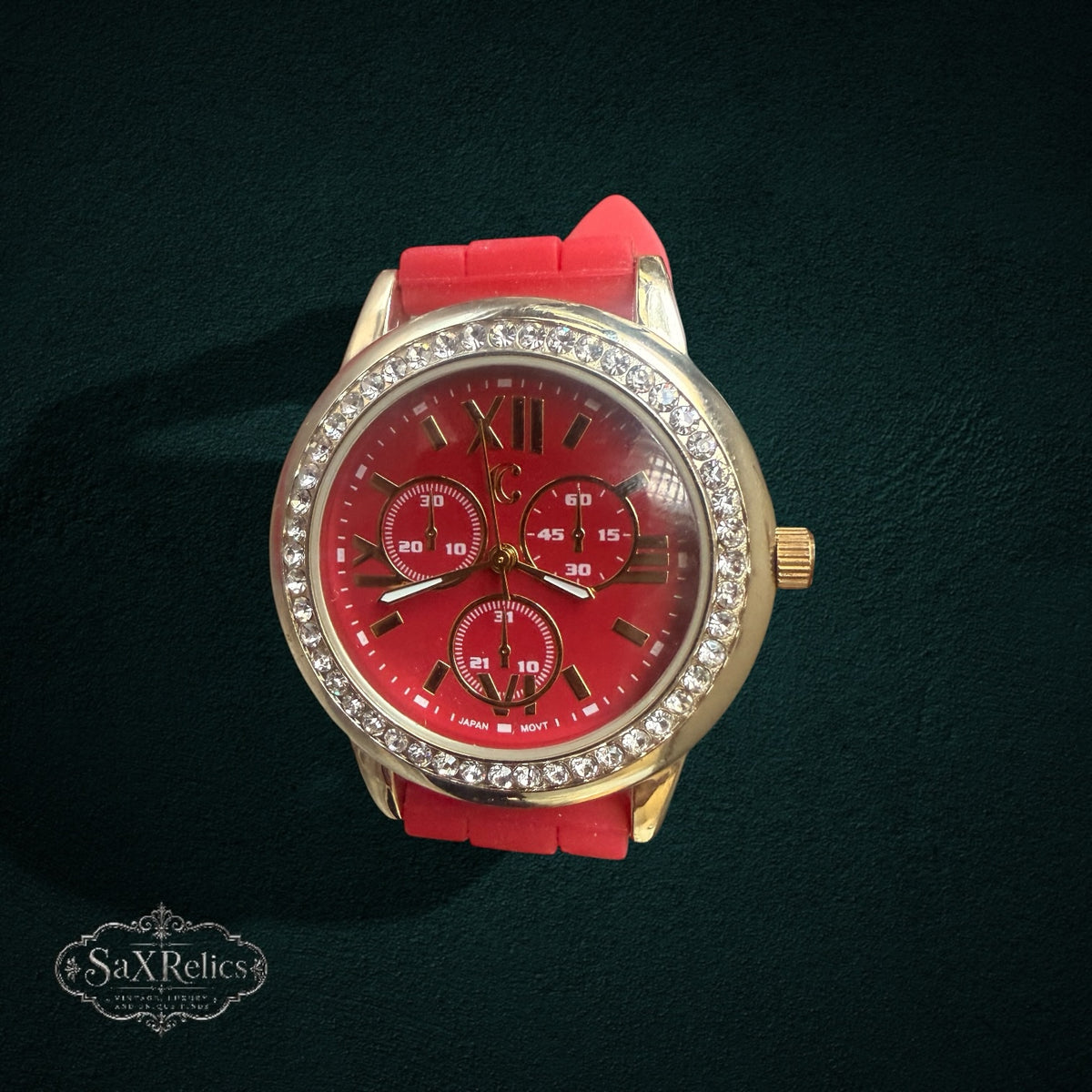 My Store red silicone strap analog watch with a gold-tone crystal-encrusted bezel and red dial