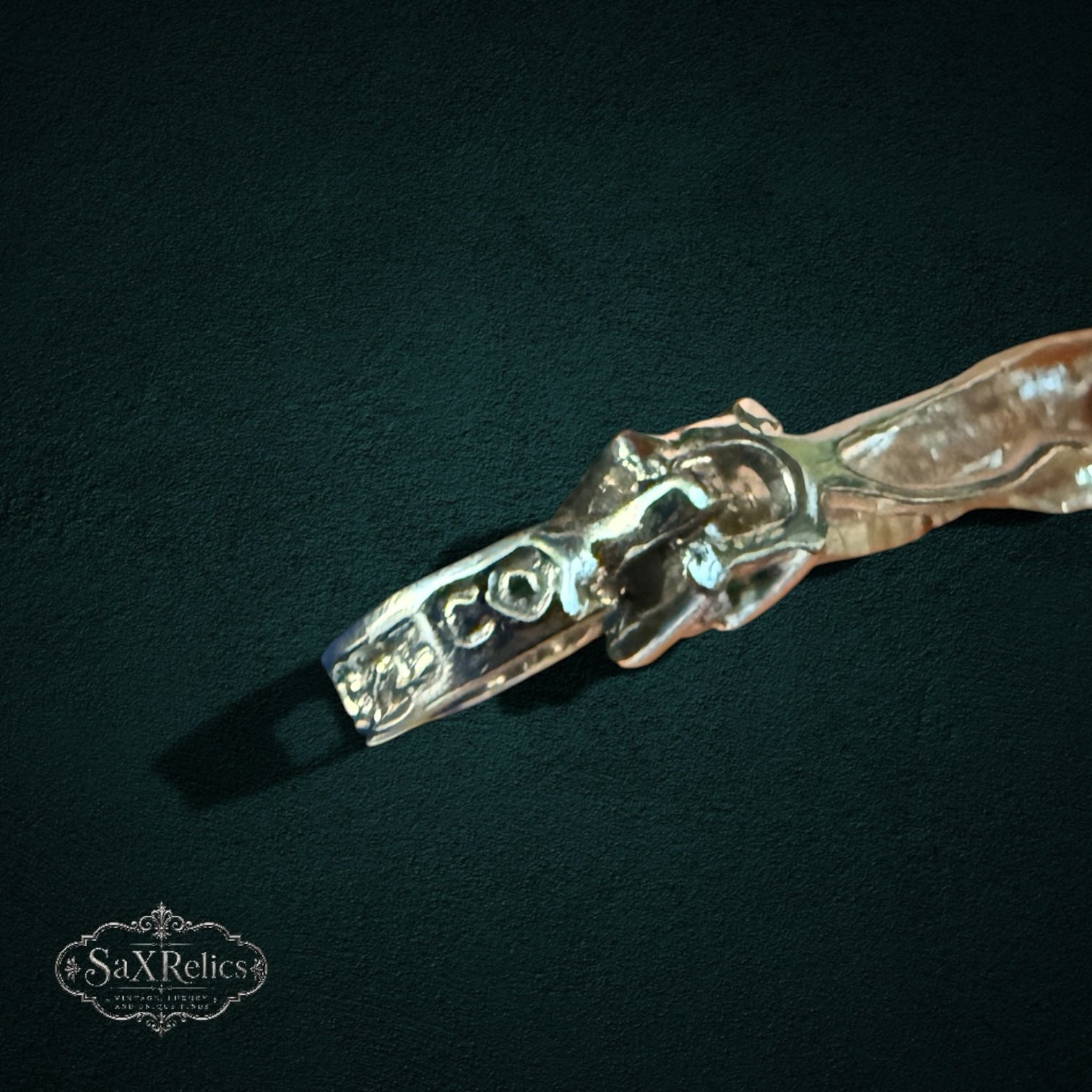 SaX Relics sterling silver bracelet showing twisted metalwork between marquise ruby settings
