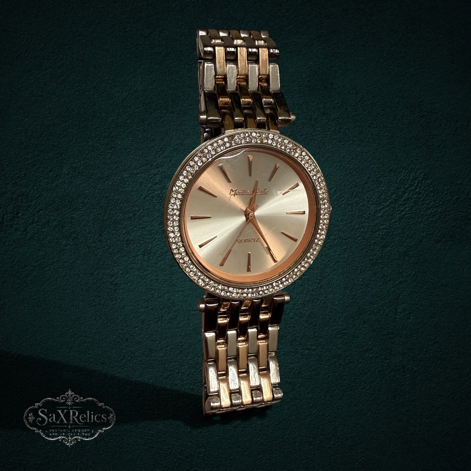 SaX Relics rose gold-tone watch with a crystal-set bezel and two-tone link bracelet