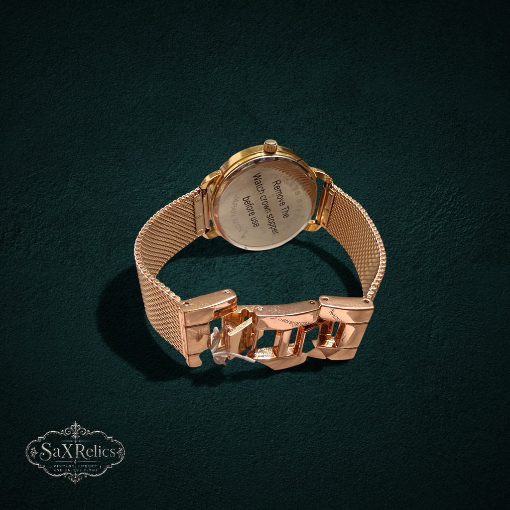 My Store rose gold analog watch with adjustable mesh strap and stainless steel back, shown from the rear view.