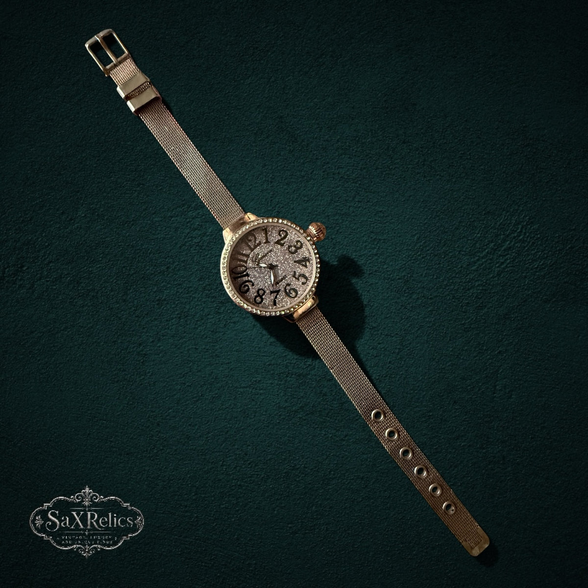 My Store rose gold analog watch with a crystal-encrusted bezel, glitter dial, and stainless steel mesh strap.