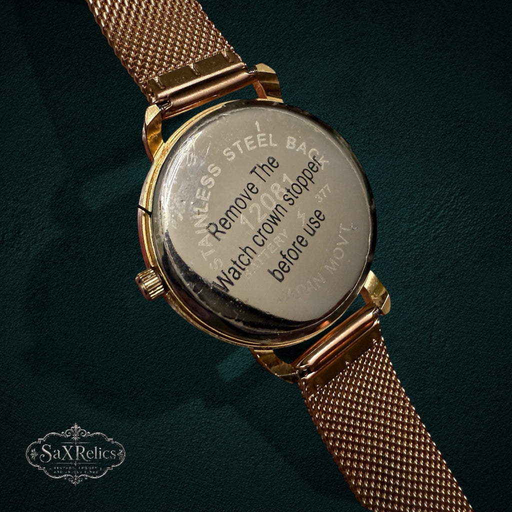 My Store rose gold analog watch with stainless steel case back and adjustable mesh strap, back view.