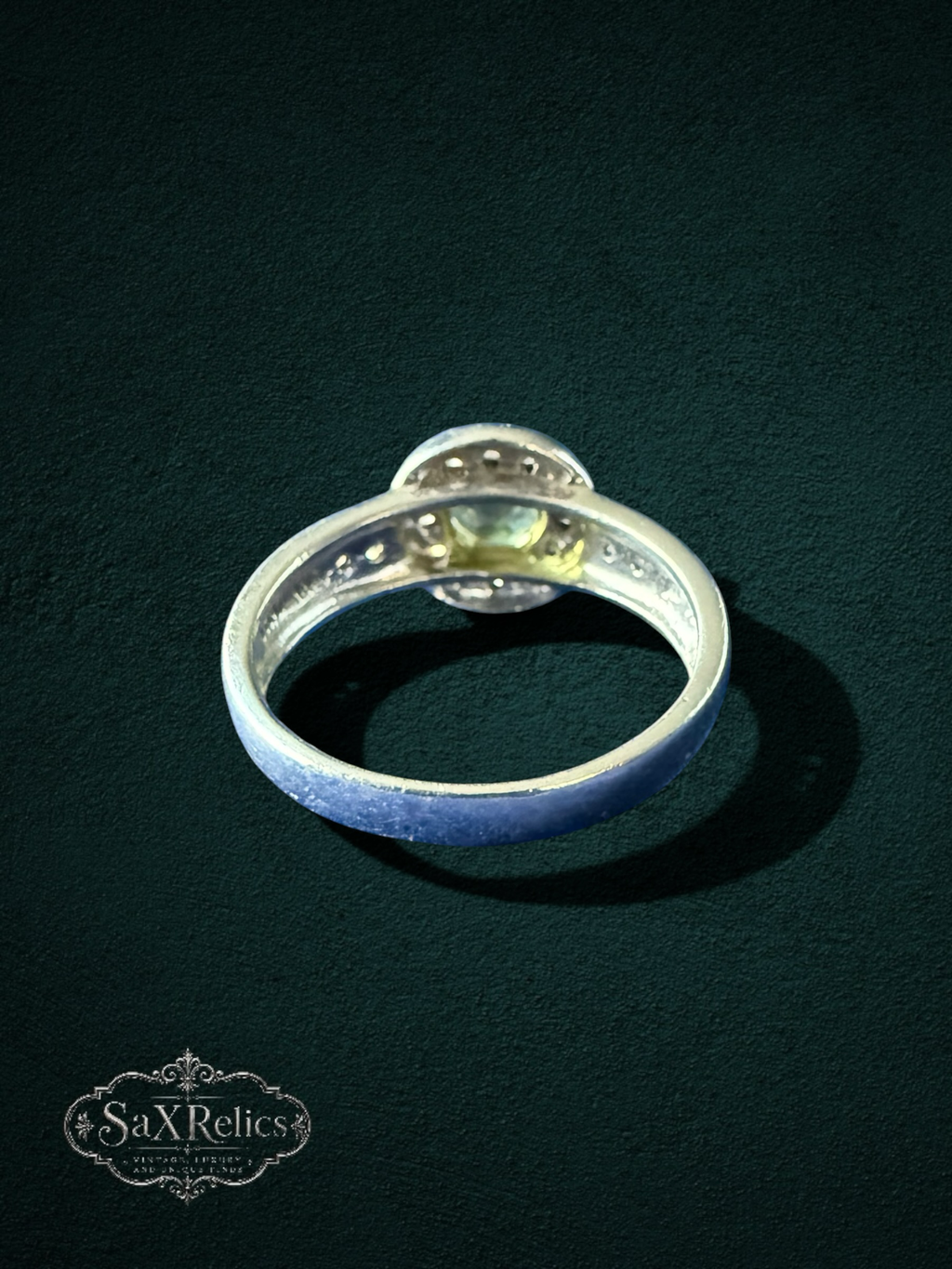 My Store elegant silver-tone halo ring featuring a round-cut yellow-green gemstone with sparkling accent stones.