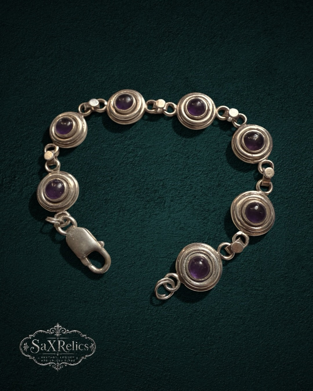 My Store SAXRelics vintage sterling silver link bracelet featuring deep purple amethyst cabochons in circular settings.