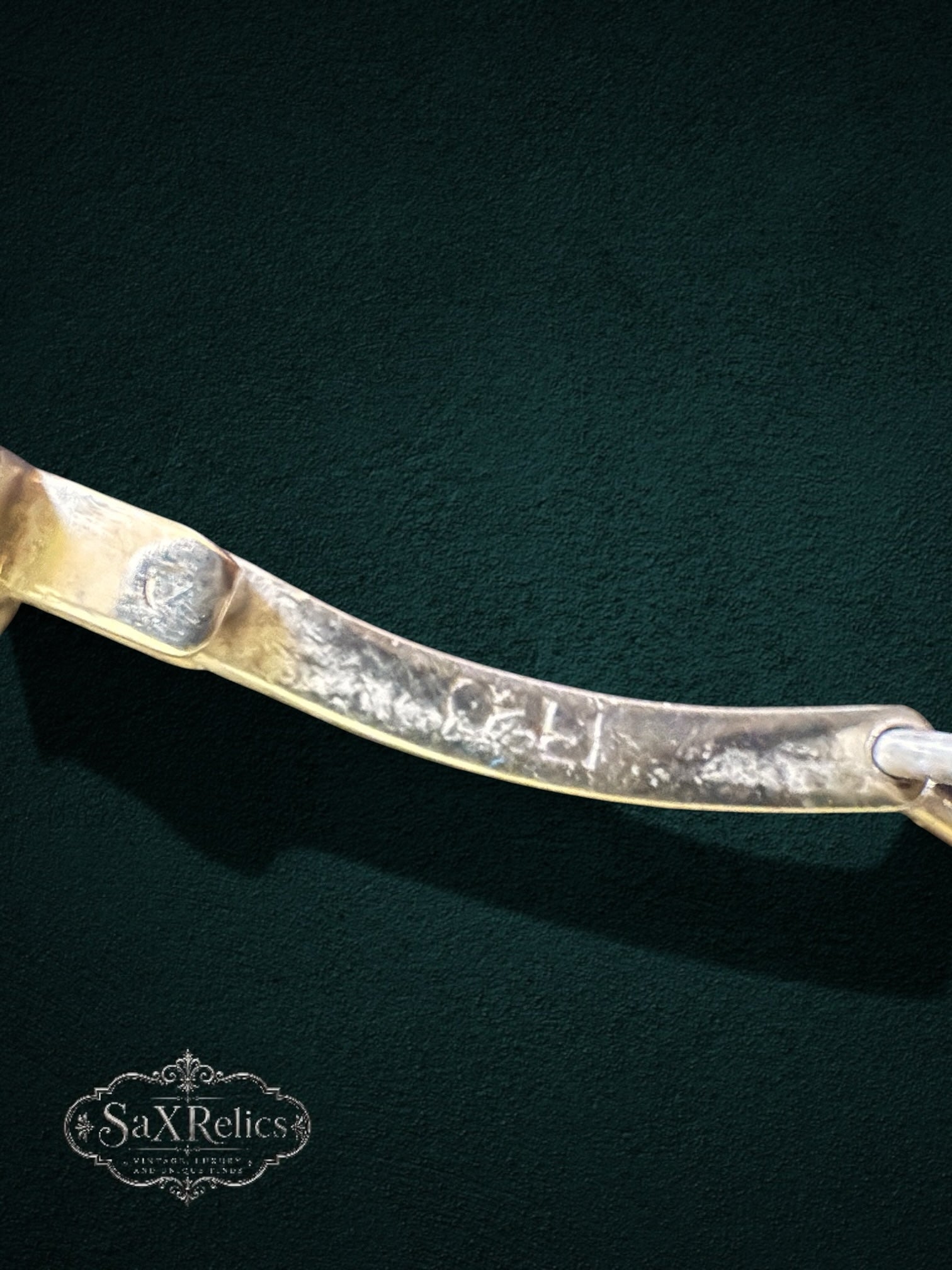 My Store SAXRelics vintage-inspired bracelet showing detailed metal hallmark on the inner link