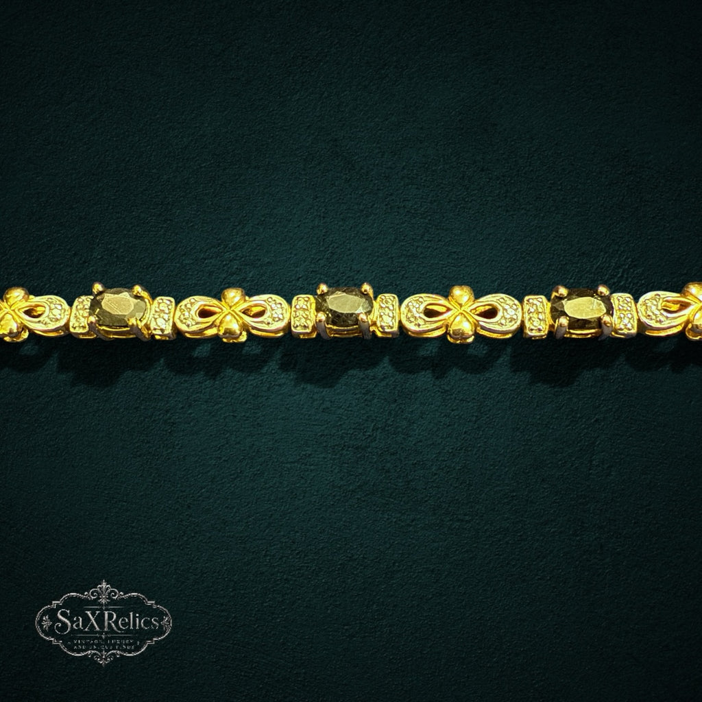 My Store SAXRelics gold-toned sterling silver link bracelet featuring oval gemstones and pave-set infinity accents.