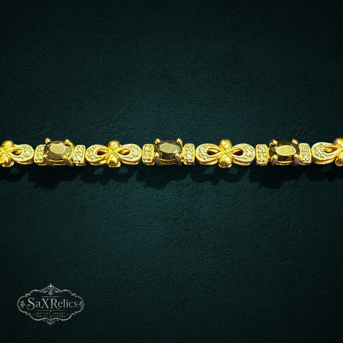 My Store SAXRelics gold-toned sterling silver link bracelet featuring oval gemstones and pave-set infinity accents.