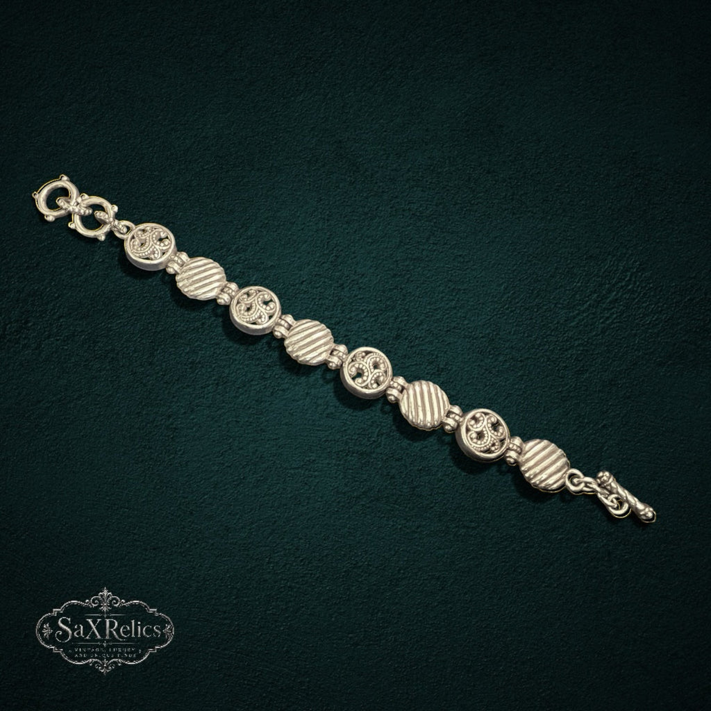 SaX Relics Brighton silver-plated bracelet showing alternating filigree medallions and ribbed links