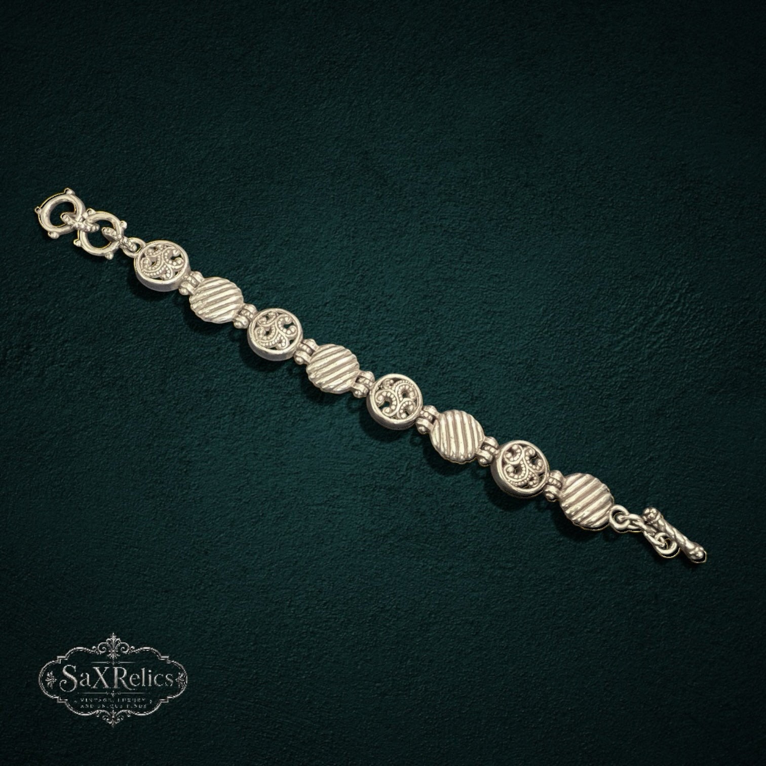 SaX Relics Brighton silver-plated bracelet showing alternating filigree medallions and ribbed links