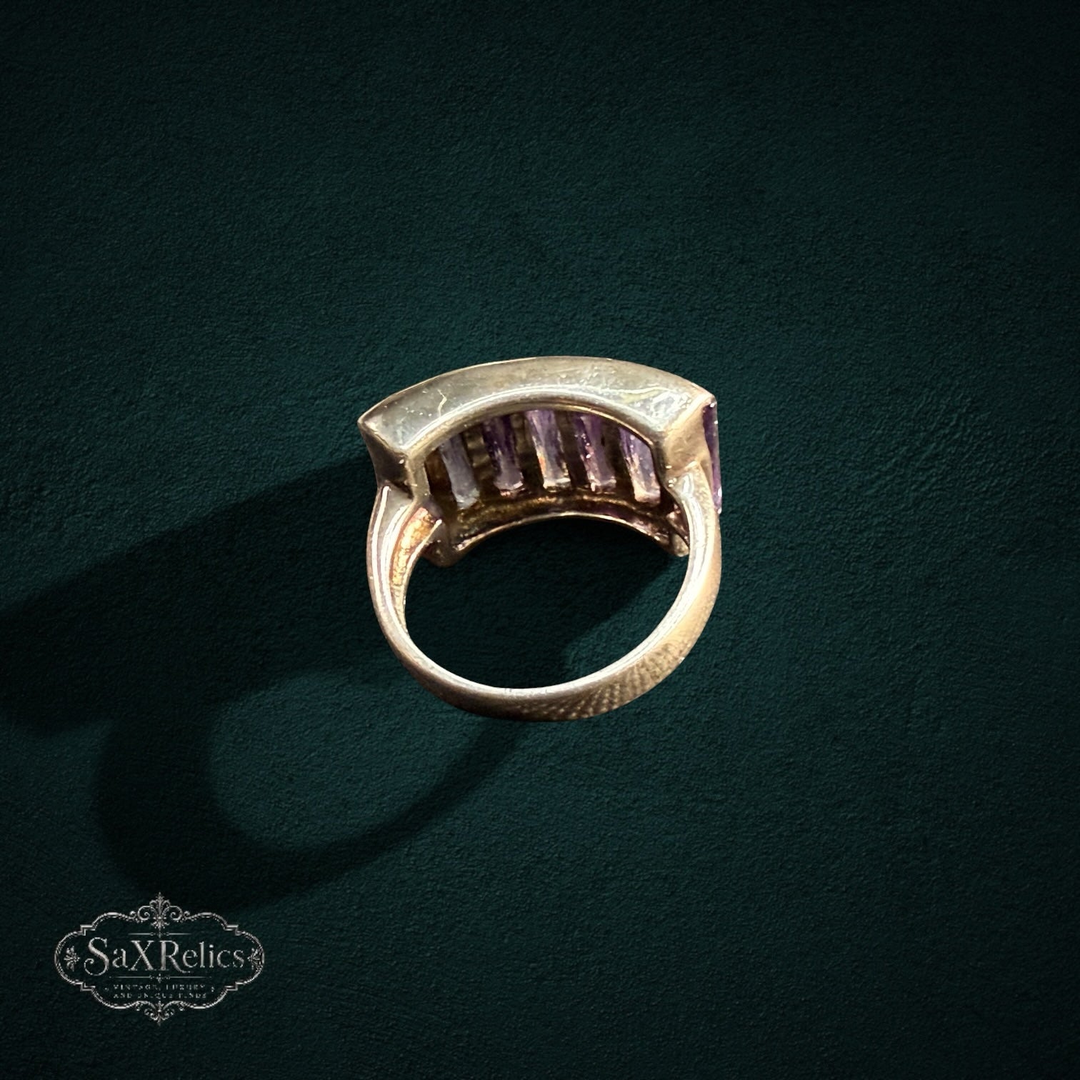 My Store SAXRelics vintage-inspired statement ring with baguette-cut purple stones in a polished wide metal band.