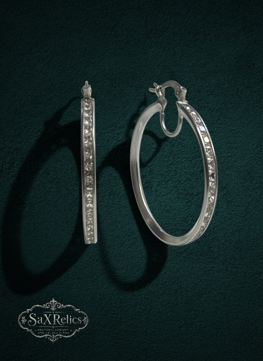 My Store SAXRelics silver-tone hoop earrings with channel-set clear stones and secure hinge closure.