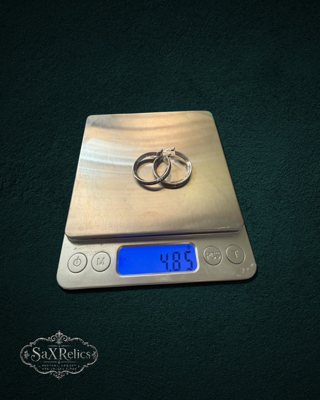 My Store SaxRelics polished sterling silver hoop earrings weighing 4.85 grams on a digital scale