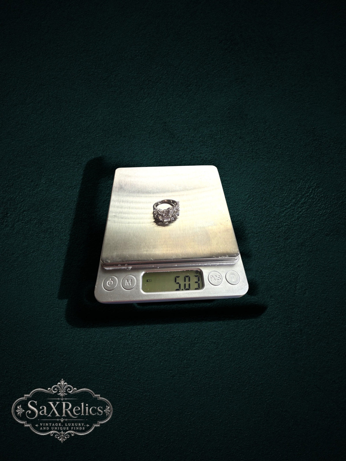 My Store SAXRelics silver-tone statement ring with sparkling cluster stones weighing 5.03 grams on a digital scale