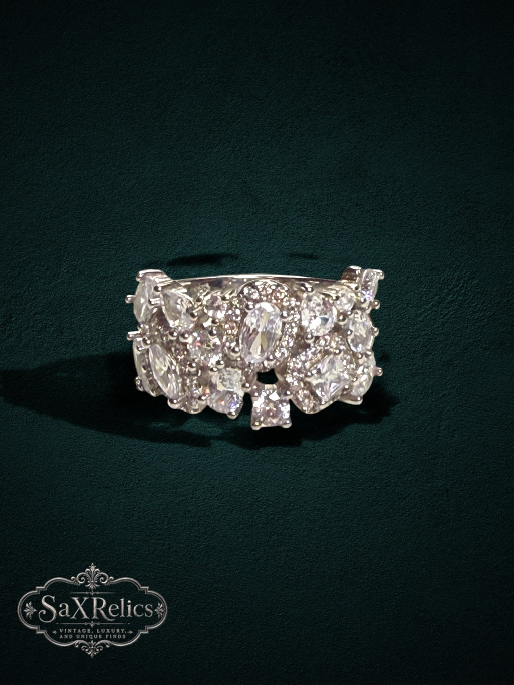 My Store SAXRelics silver-tone statement ring featuring a cluster of sparkling high-clarity stones on a split-shank band