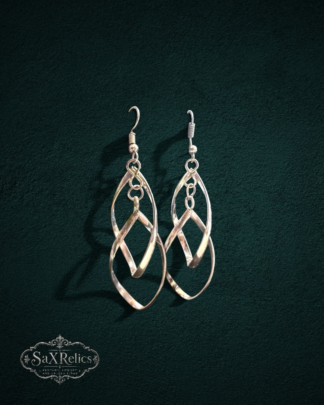 My Store SaxRelics silver-tone intertwined teardrop dangle earrings with a polished finish and hook-style backings.