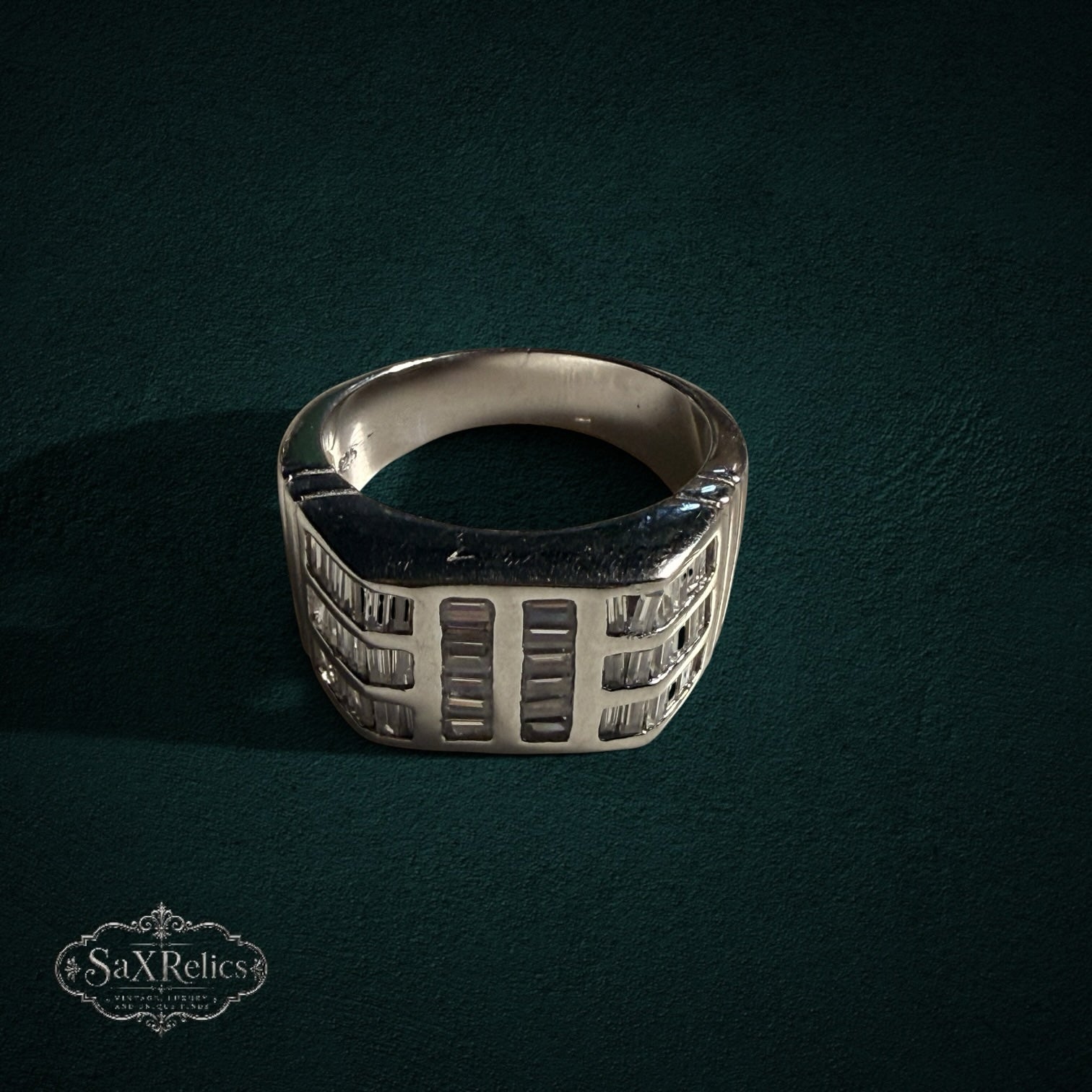 My Store SAXRelics sterling silver statement ring featuring architectural baguette-cut stones on a polished band.